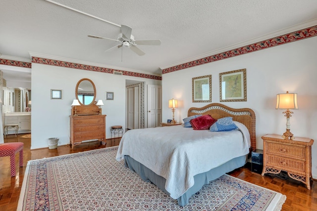 bedroom featuring ceiling fan, a textured ceiling, connected bathroom, parquet floors, and ornamental molding