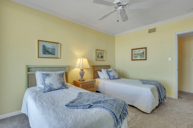 bedroom featuring crown molding, carpet floors, a textured ceiling, and ceiling fan