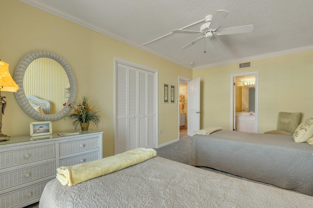 bedroom featuring ensuite bathroom, a textured ceiling, ceiling fan, crown molding, and carpet