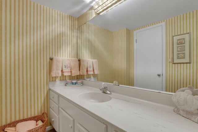 bathroom featuring vanity and a skylight