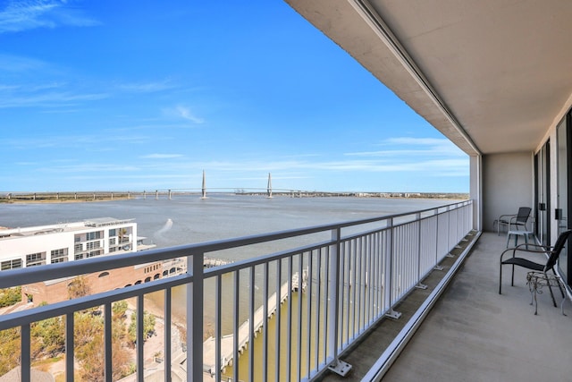 balcony featuring a water view