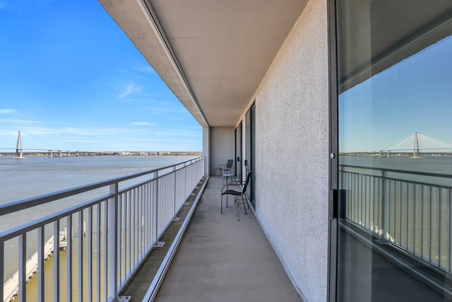 balcony featuring a water view