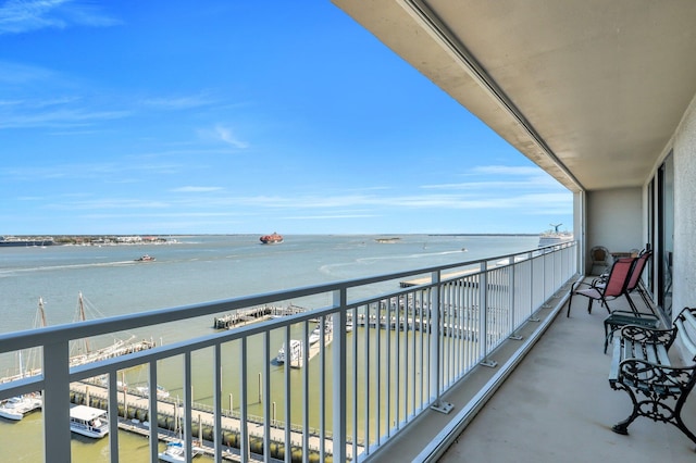 balcony featuring a water view