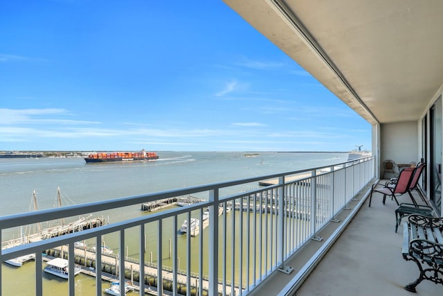 balcony featuring a water view