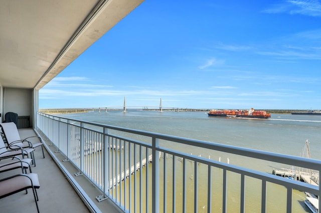 balcony featuring a water view