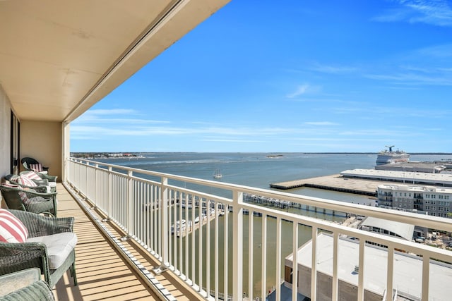 balcony featuring a water view