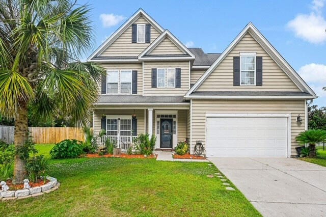 view of front of house with a front lawn and a garage