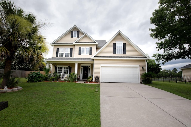 craftsman house with a porch, a front yard, and a garage