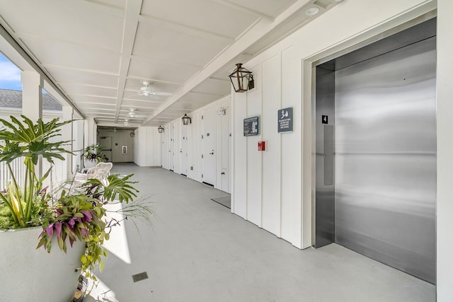 hallway featuring elevator