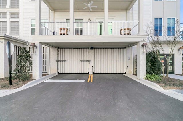 exterior space with ceiling fan and a balcony