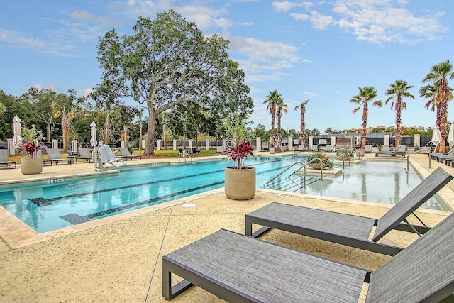 view of swimming pool with a patio area