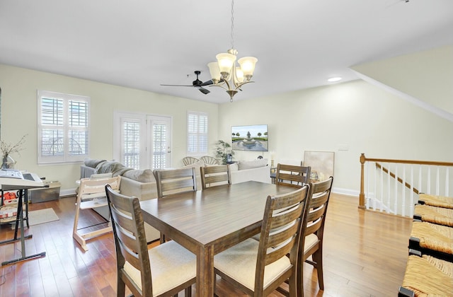 dining area with hardwood / wood-style flooring, ceiling fan with notable chandelier, baseboards, and recessed lighting