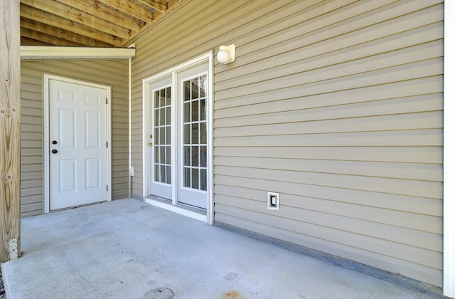 doorway to property with a patio