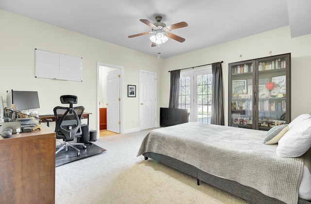 bedroom featuring ceiling fan, carpet floors, access to exterior, baseboards, and ensuite bath