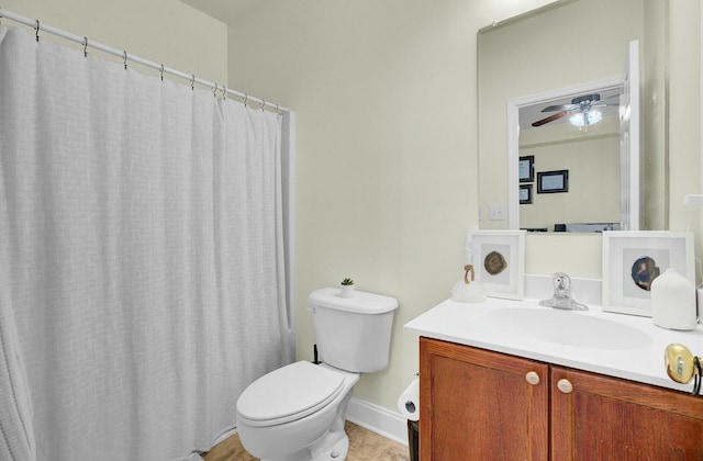 bathroom with toilet, curtained shower, and vanity