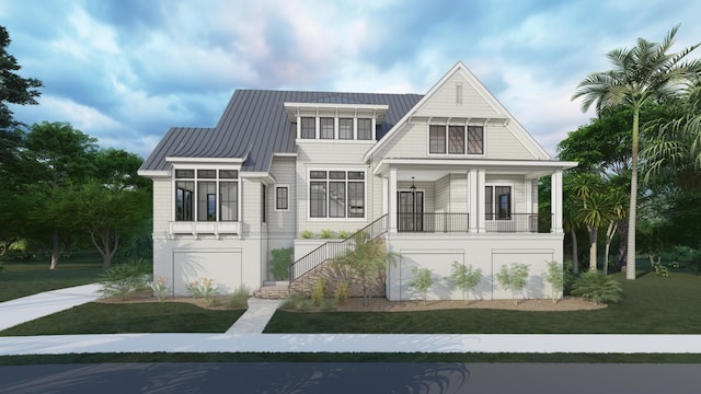 view of front facade featuring a front lawn and covered porch