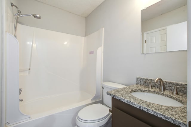 full bathroom with a textured ceiling, vanity, toilet, and  shower combination