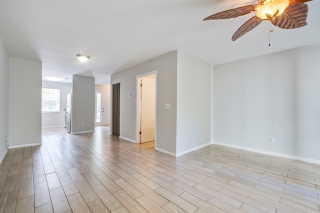 unfurnished room featuring ceiling fan and light hardwood / wood-style floors