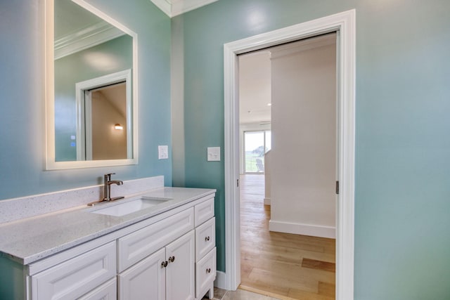 125 Oak Bay Dr, Georgetown, SC 29440 - bathroom with ornamental molding, vanity, and wood finished floors