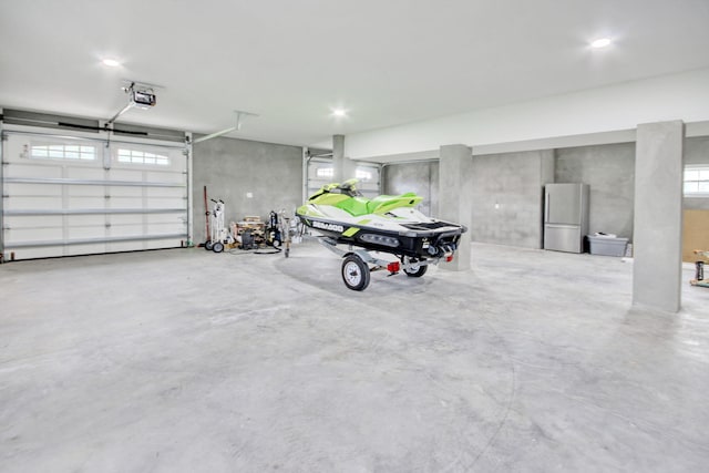 125 Oak Bay Dr, Georgetown, SC 29440 - garage with freestanding refrigerator and a garage door opener