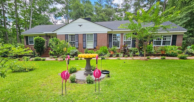 ranch-style home featuring a front lawn