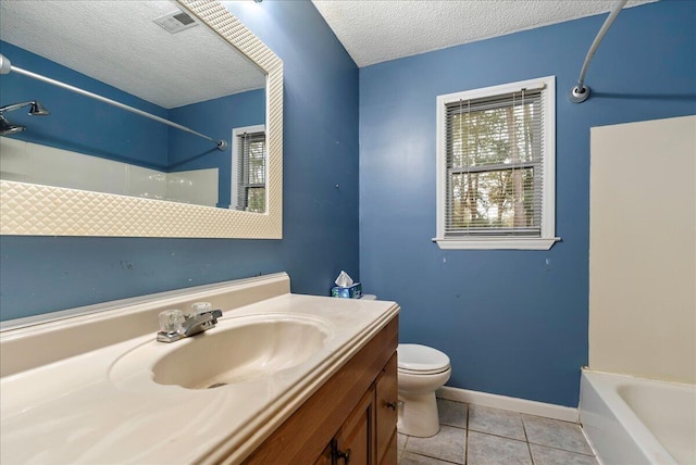 full bathroom featuring shower / bathing tub combination, vanity, toilet, tile patterned floors, and a textured ceiling