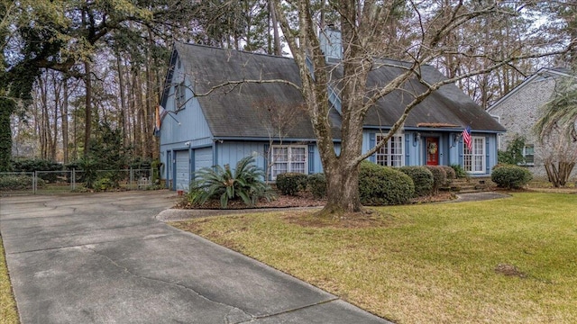 view of front facade featuring a garage and a front lawn