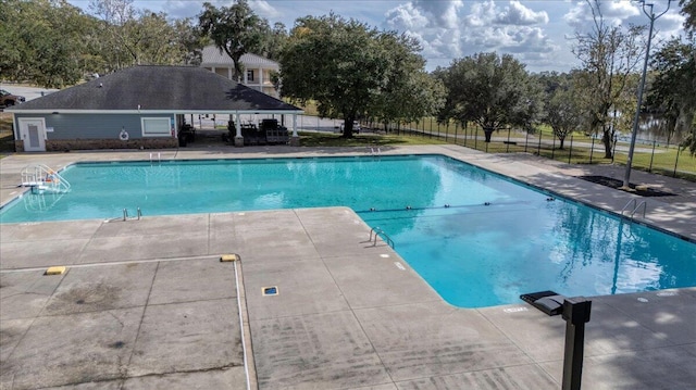 view of swimming pool with a patio area