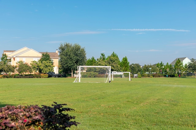 view of property's community featuring an area for sports