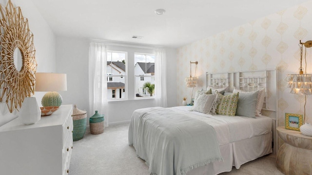 carpeted bedroom with baseboards