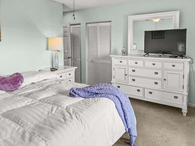 bedroom featuring dark colored carpet