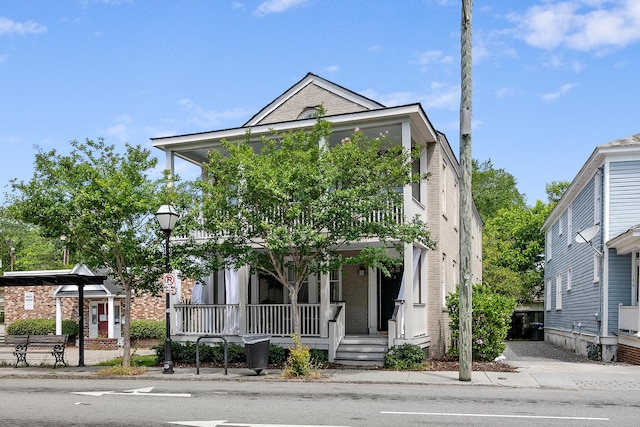 170 Spring St, Charleston, SC 29403 - view of front of property featuring covered porch and brick siding