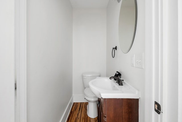 170 Spring St, Charleston, SC 29403 - half bath featuring vanity and wood finished floors