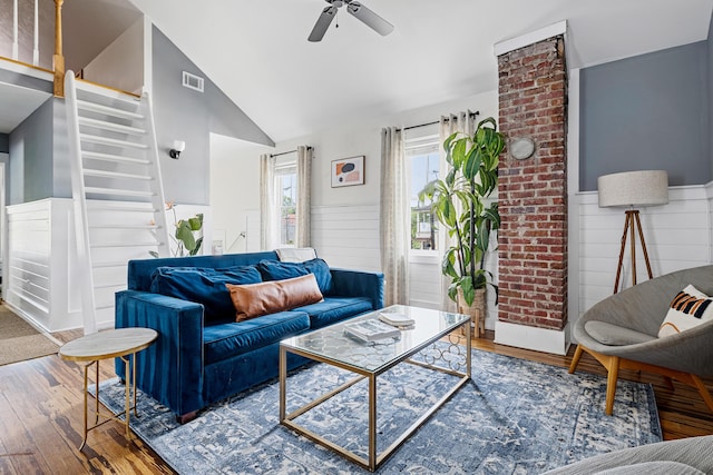 170 Spring St, Charleston, SC 29403 - living area with a wainscoted wall, a ceiling fan, hardwood / wood-style flooring, vaulted ceiling, and stairs