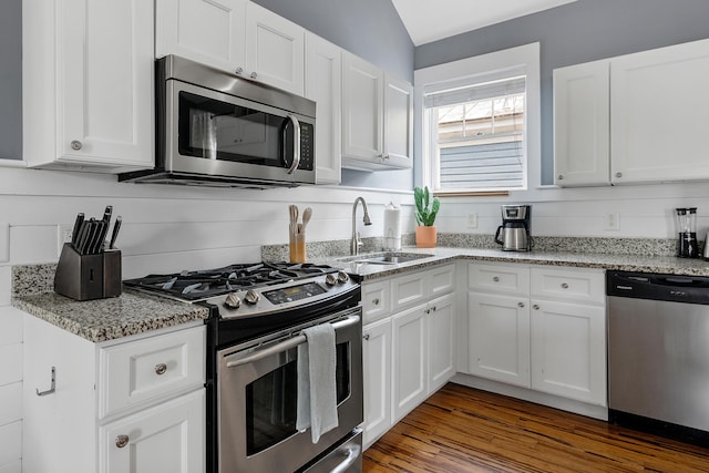170 Spring St, Charleston, SC 29403 - kitchen featuring stainless steel appliances, white cabinets, and light stone countertops
