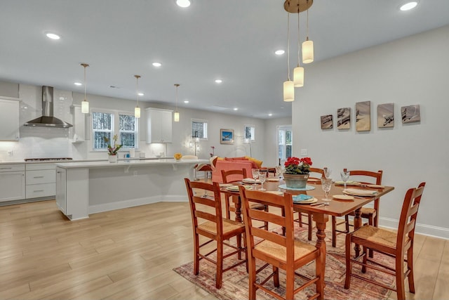 dining space with light wood-type flooring