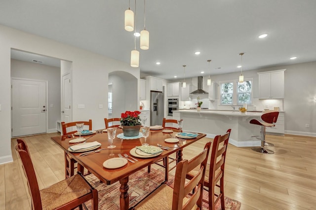 dining space featuring light hardwood / wood-style flooring