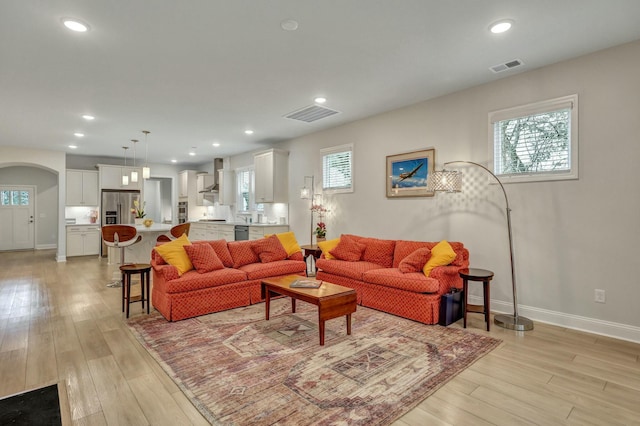 living room with light hardwood / wood-style floors