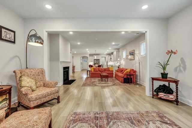 living room with light hardwood / wood-style flooring