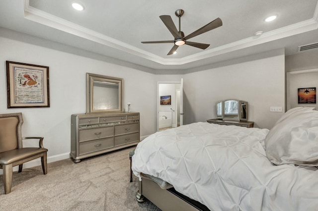 bedroom featuring ceiling fan, light colored carpet, ornamental molding, and a tray ceiling