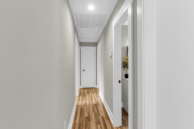 6305 Lucille Dr, North Charleston, SC 29406 - hallway featuring attic access, light wood-style floors, and baseboards