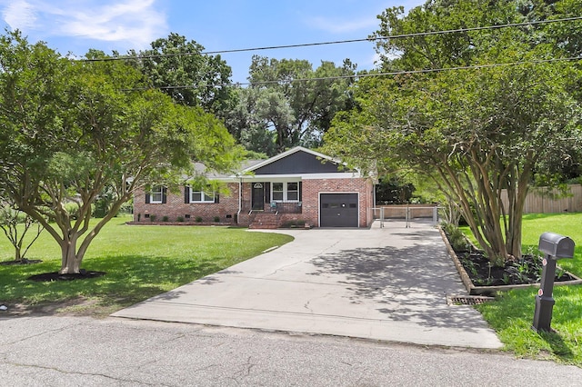 6305 Lucille Dr, North Charleston, SC 29406 - view of front facade featuring concrete driveway, brick siding, crawl space, and a garage