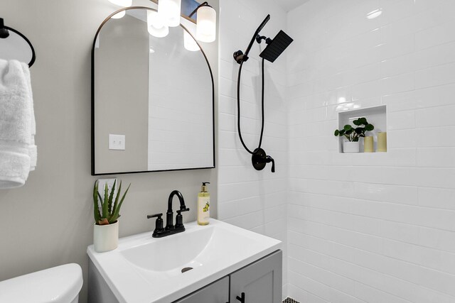 6305 Lucille Dr, North Charleston, SC 29406 - bathroom featuring vanity, a tile shower, and toilet