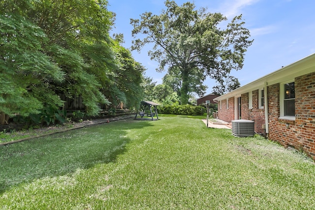 6305 Lucille Dr, North Charleston, SC 29406 - view of green lawn with central AC