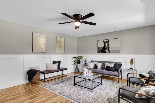 6305 Lucille Dr, North Charleston, SC 29406 - living area featuring ceiling fan, a wainscoted wall, wood finished floors, and a decorative wall