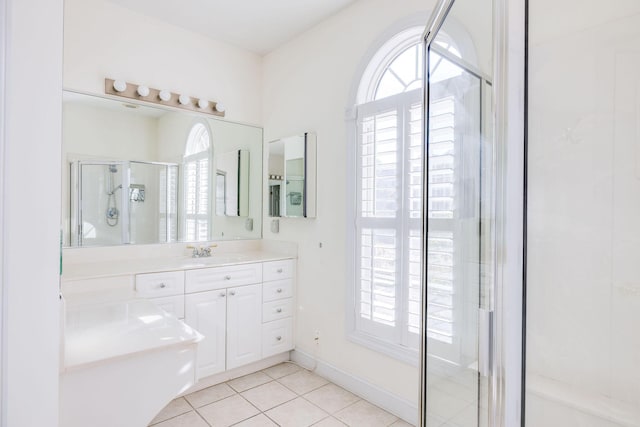 bathroom featuring tile patterned flooring, vanity, and an enclosed shower