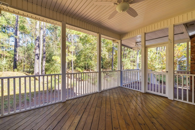 unfurnished sunroom featuring ceiling fan