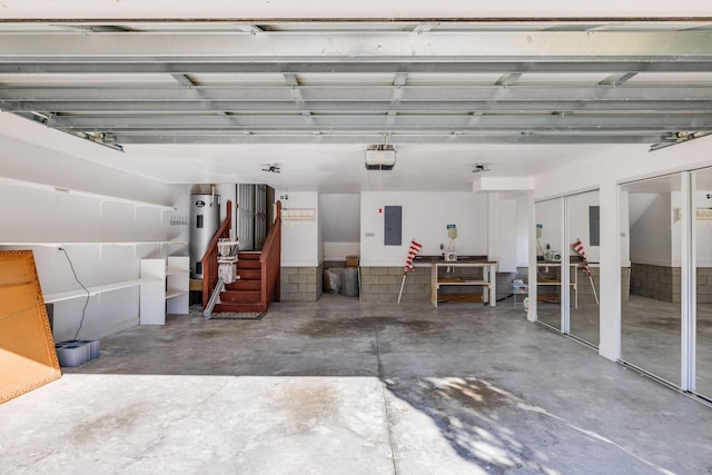 garage featuring electric panel, water heater, and a garage door opener