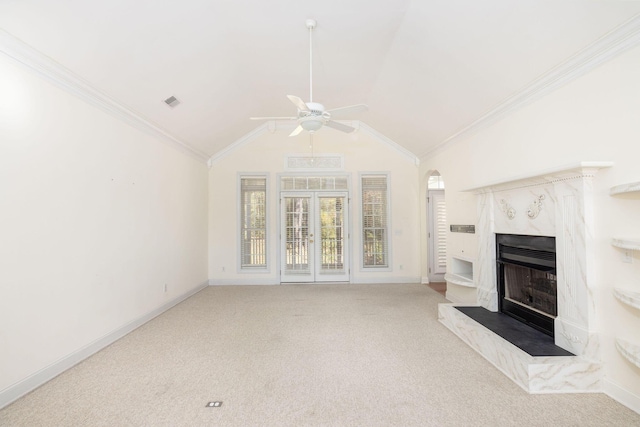 unfurnished living room with carpet flooring, lofted ceiling, and a premium fireplace