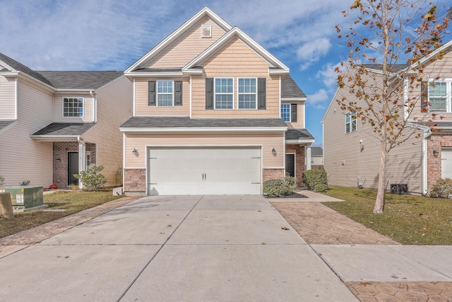 view of front of home with a front lawn, a garage, and cooling unit